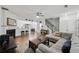 Bright living room features a fireplace, ceiling fan, and hardwood floors at 10900 Wittenridge Dr # I4, Alpharetta, GA 30022
