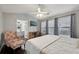 This is a main bedroom with hardwood floors, a ceiling fan, and large windows to let in the light at 10900 Wittenridge Dr # I4, Alpharetta, GA 30022