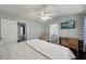 Main bedroom with vaulted ceilings, fan and access to attached bathroom and laundry at 10900 Wittenridge Dr # I4, Alpharetta, GA 30022