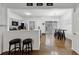 Open concept kitchen and dining area, with bar seating and easy access to kitchen appliances at 10900 Wittenridge Dr # I4, Alpharetta, GA 30022