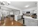 Open concept kitchen and living area with hardwood floors throughout at 10900 Wittenridge Dr # I4, Alpharetta, GA 30022