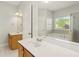 Bathroom with double sink vanity, a soaking tub, and a shower providing a spa-like experience at 113 Highgrove Pl, Mcdonough, GA 30253