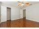 Bedroom with hardwood floors, ample closet space, and natural light for a comfortable retreat at 113 Highgrove Pl, Mcdonough, GA 30253