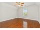 Bedroom with hardwood floors, a window, and neutral walls for a versatile space at 113 Highgrove Pl, Mcdonough, GA 30253