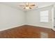 Bright bedroom with hardwood floors, a ceiling fan, and plenty of natural light at 113 Highgrove Pl, Mcdonough, GA 30253