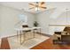 Bright office space featuring a modern desk, a ceiling fan, and stylish decor for a comfortable work environment at 113 Highgrove Pl, Mcdonough, GA 30253