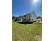 Expansive backyard with lush lawn and views of the two-story home at 205 Sullivan St, Hampton, GA 30228