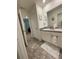 Bathroom featuring double sinks, tile flooring and white cabinets at 205 Sullivan St, Hampton, GA 30228