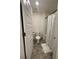 Clean bathroom with tile floor, white fixtures, and a shower with curtain at 205 Sullivan St, Hampton, GA 30228