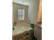 Bright bathroom featuring a large bathtub with window at 205 Sullivan St, Hampton, GA 30228