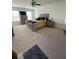 Bright bedroom with large windows, a ceiling fan, and neutral decor creating a cozy retreat at 205 Sullivan St, Hampton, GA 30228