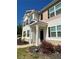 Two-story home with black shutters and manicured front yard. The address 205 is visible above the door at 205 Sullivan St, Hampton, GA 30228