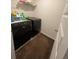 Laundry room with black washer and dryer at 205 Sullivan St, Hampton, GA 30228