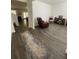 Cozy living room featuring dark wood floors, and neutral wall paint providing a simple background at 205 Sullivan St, Hampton, GA 30228
