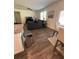Open living space shows the kitchen, dining area, and a comfortable sofa at 205 Sullivan St, Hampton, GA 30228