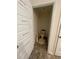 Small toilet room with toilet, decorative wall hangings, and neutral paint scheme at 205 Sullivan St, Hampton, GA 30228