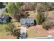 Overhead aerial view of the house with a long driveway, manicured lawn, and mature trees on a large lot at 33 Blue Springs Way, Dallas, GA 30157