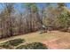 View of backyard featuring a swing set and partially fenced yard at 33 Blue Springs Way, Dallas, GA 30157
