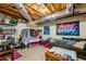 Finished basement area with exposed ceiling, bunk beds, and lounging area for entertaining and relaxation at 33 Blue Springs Way, Dallas, GA 30157