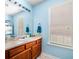 Bathroom featuring a large vanity and a window for natural light at 33 Blue Springs Way, Dallas, GA 30157