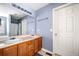 Bathroom featuring double sinks, neutral tones, and a large mirror at 33 Blue Springs Way, Dallas, GA 30157
