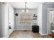 Bright dining area with tile floors, a window, and an exit door at 33 Blue Springs Way, Dallas, GA 30157