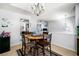 Cozy dining room featuring a round table and unique decor leading into other living spaces at 33 Blue Springs Way, Dallas, GA 30157