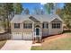 Charming two-story home with a well-manicured lawn, inviting entrance, and a two-car garage at 33 Blue Springs Way, Dallas, GA 30157
