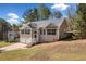 Charming home with a two-car garage, inviting entrance, well-maintained lawn, and traditional architectural style at 33 Blue Springs Way, Dallas, GA 30157