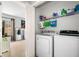 Convenient laundry room with washer, dryer, and storage shelf at 33 Blue Springs Way, Dallas, GA 30157