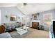 Inviting living room with vaulted ceiling, fireplace, and view of the kitchen at 33 Blue Springs Way, Dallas, GA 30157
