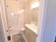 Elegant bathroom with tiled shower, sleek vanity, and modern finishes at 4881 Belle Estates Rd, Suwanee, GA 30024