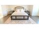 Inviting bedroom featuring neutral tones, a cozy bed, and decorative bedside tables at 4881 Belle Estates Rd, Suwanee, GA 30024