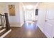 Bright and airy foyer with hardwood floors, a white front door, and neutral decor at 4881 Belle Estates Rd, Suwanee, GA 30024