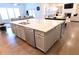 Large kitchen island with a sink, dishwasher, and drawers in a contemporary home kitchen at 4881 Belle Estates Rd, Suwanee, GA 30024
