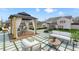 Inviting backyard featuring a cozy gazebo, stylish patio furniture, and a lush green lawn at 5130 Travers Ln, Cumming, GA 30040