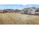 New construction home featuring a spacious backyard ready for customization with views of surrounding homes at 5130 Travers Ln, Cumming, GA 30040