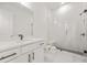 Modern bathroom with a walk-in shower, a vanity and tile flooring at 5130 Travers Ln, Cumming, GA 30040