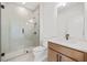 Modern bathroom featuring glass shower enclosure, sleek vanity, and neutral color palette at 5130 Travers Ln, Cumming, GA 30040