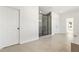 Modern bathroom with a glass-enclosed shower and neutral tile flooring at 5130 Travers Ln, Cumming, GA 30040