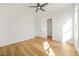 Bright bedroom with hardwood floors and a large walk-in closet at 5130 Travers Ln, Cumming, GA 30040