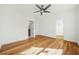 Spacious bedroom with hardwood floors, walk in closet, and neutral wall colors at 5130 Travers Ln, Cumming, GA 30040