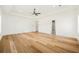 Large bedroom featuring hardwood floors, a ceiling fan, recessed lighting, and a neutral color palette at 5130 Travers Ln, Cumming, GA 30040