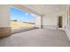 A covered patio with a concrete floor and an open view of the outside at 5130 Travers Ln, Cumming, GA 30040