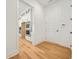Hallway view of a modern kitchen with white cabinets and stainless steel appliances at 5130 Travers Ln, Cumming, GA 30040