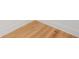 Close up of the hardwood flooring and base trim at 5130 Travers Ln, Cumming, GA 30040