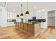 Gourmet kitchen featuring a large island, stainless steel appliances, and plenty of cabinet storage at 5130 Travers Ln, Cumming, GA 30040