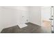 Laundry room with tile flooring, wire shelving, and convenient access to adjacent room at 5130 Travers Ln, Cumming, GA 30040