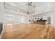 Large open-concept living space with hardwood floors, high ceilings, and a large kitchen at 5130 Travers Ln, Cumming, GA 30040