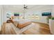 Spacious main bedroom featuring a ceiling fan, tray ceiling, and lots of natural light at 5130 Travers Ln, Cumming, GA 30040